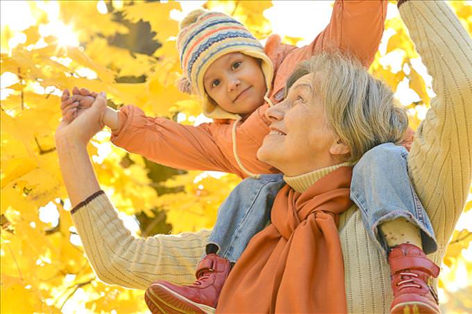 grandmother with child on shoulders