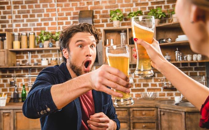 shocked man toasting with beer