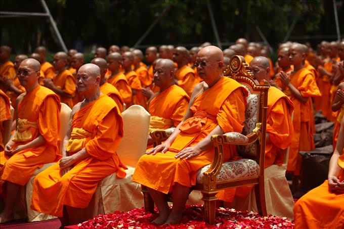 group of monks wearing orange