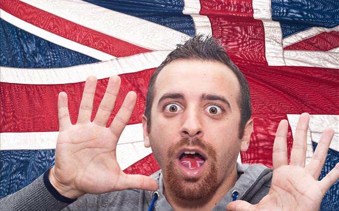 scared man in front of UK flag