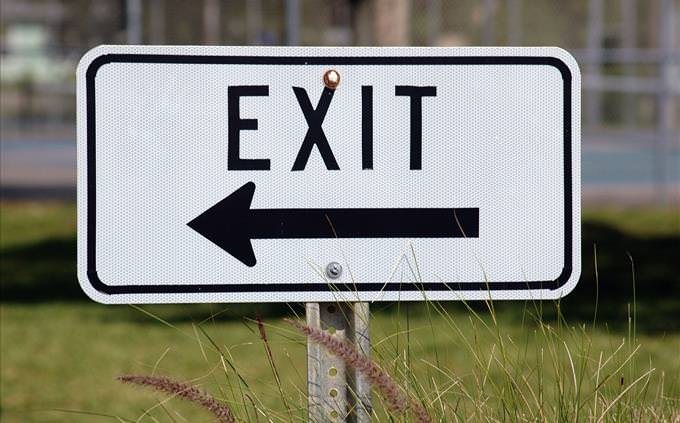 black exit on left sign