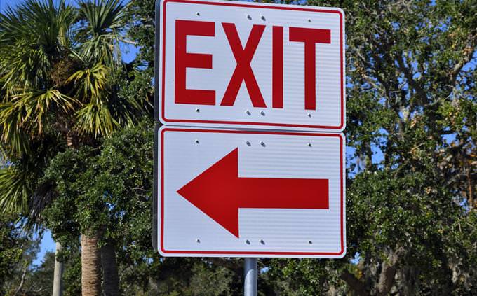 red exit on left sign