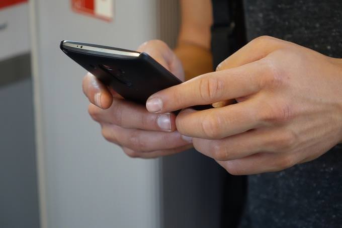 Hands holding a smartphone