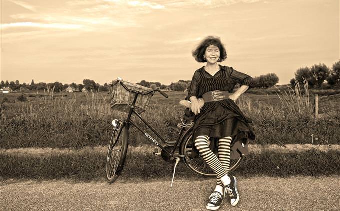 vintage photo of girl with bicycle