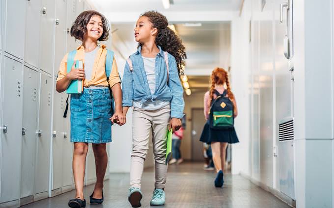 schoolgirls walking down corridor