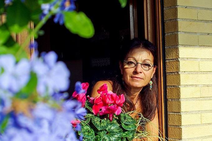 woman looking out a window