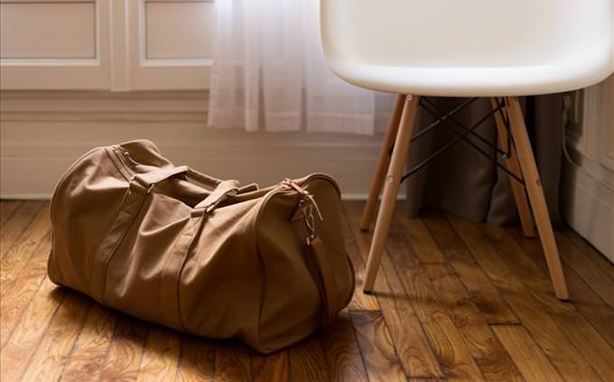 brown suitcase and chair