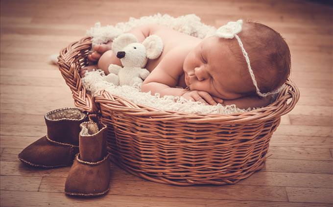 baby sleeping in basket