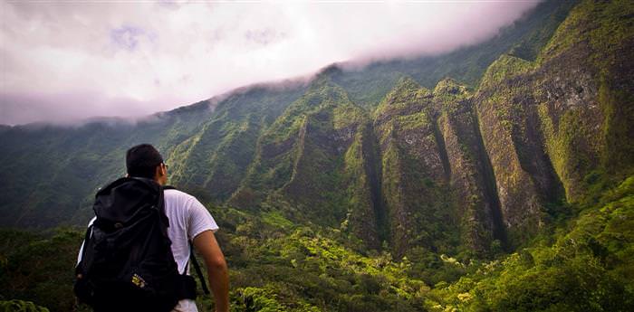 mental strength: the back of a man look out to mountains