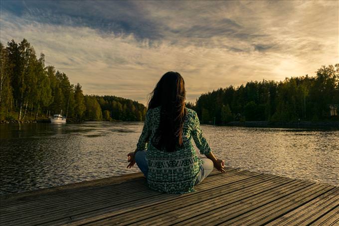 woman meditating in nature