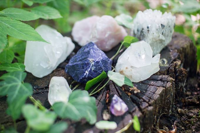 healing crystals on a tree stump