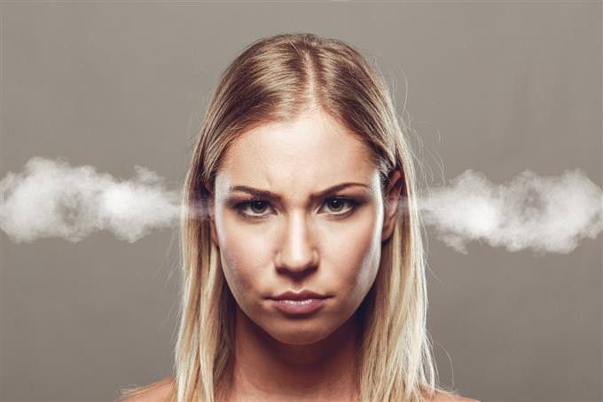 woman with smoke coming out of her ears