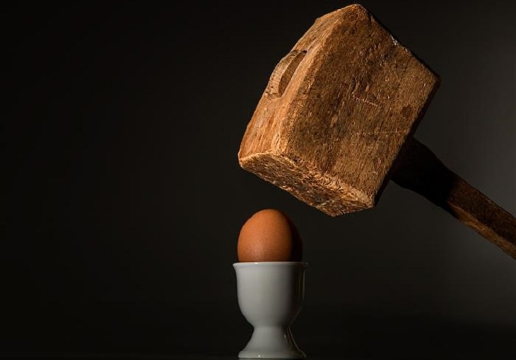 hammer about to break egg