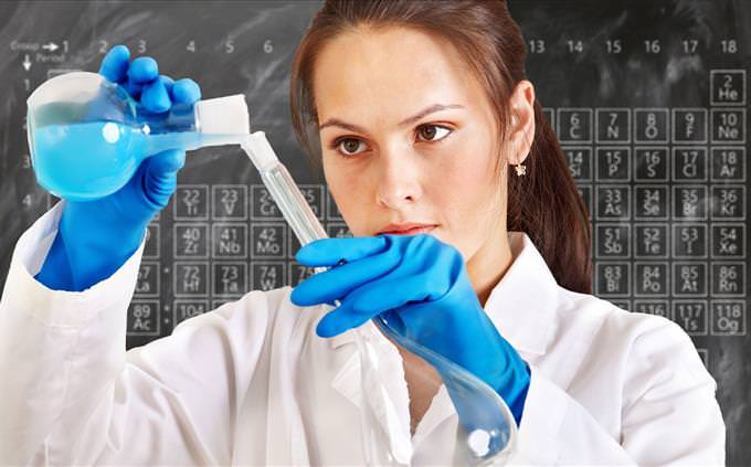 female chemist performing an experiment