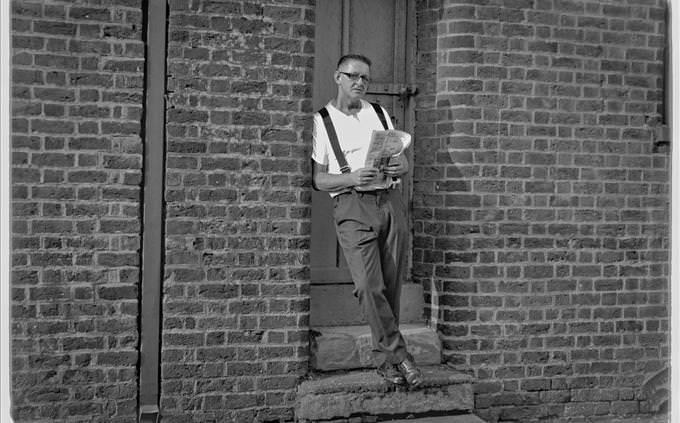 vintage photo of man standing in doorway
