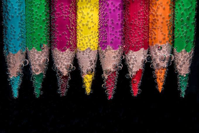Colored pencils dipped in water