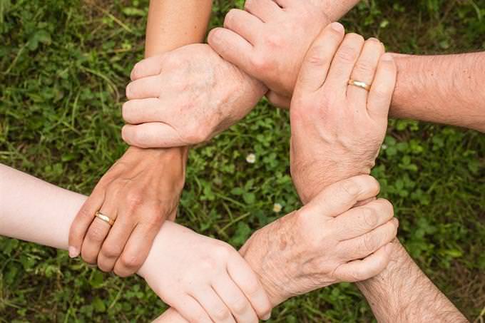 Hands holding each other in a circle