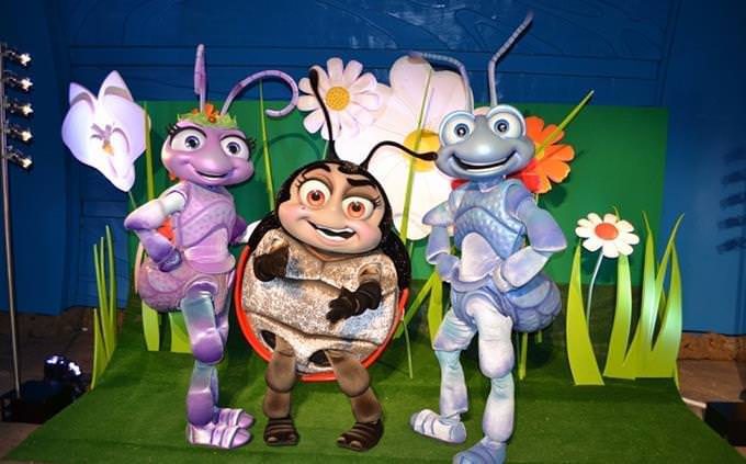 3 people dressed as characters from the movie "A Bug’s Life"