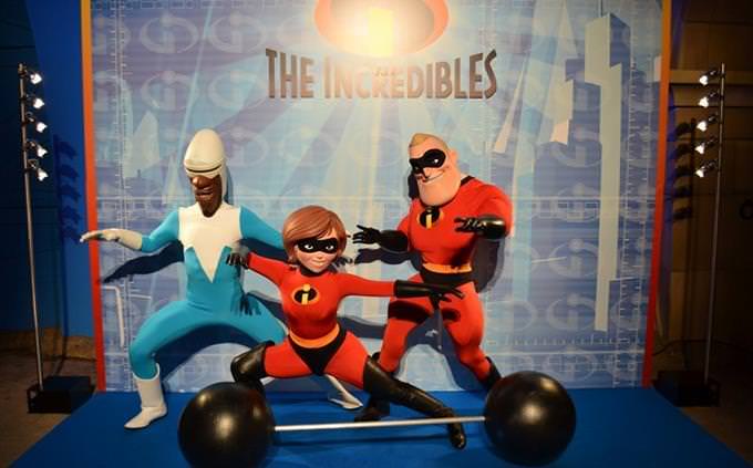 Three people dressed as The Incredibles