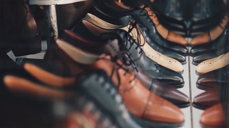 mens leather shoes lined up in rows