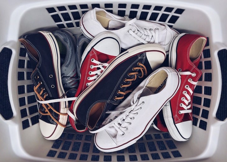 a laundry basket full of sports shoes