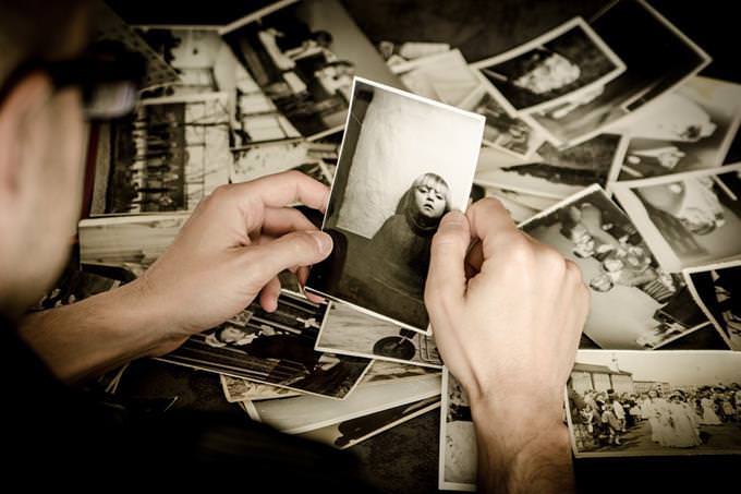 A woman looking at old pictures