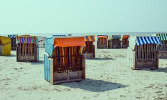 Find the differences: cabanas on a beach