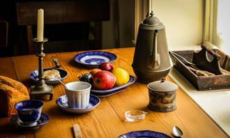 Find the differences: table with food and dishes on it