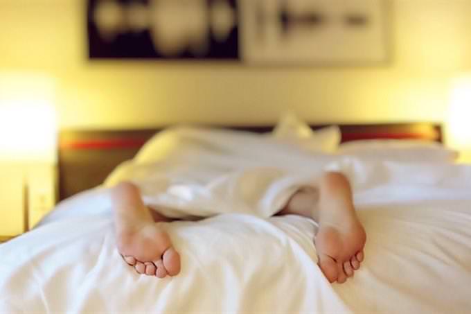 Feet peeking out of a blanket