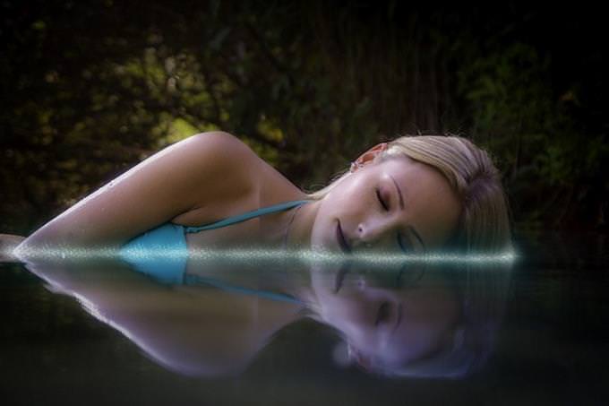 A woman sleeping in water