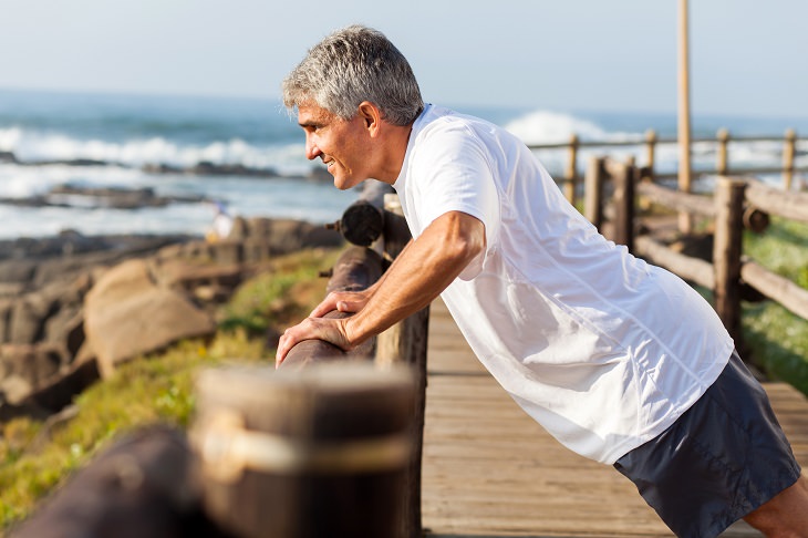 man exercising by the sea