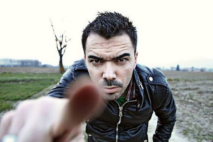 a man pointing an angry finger at the camera
