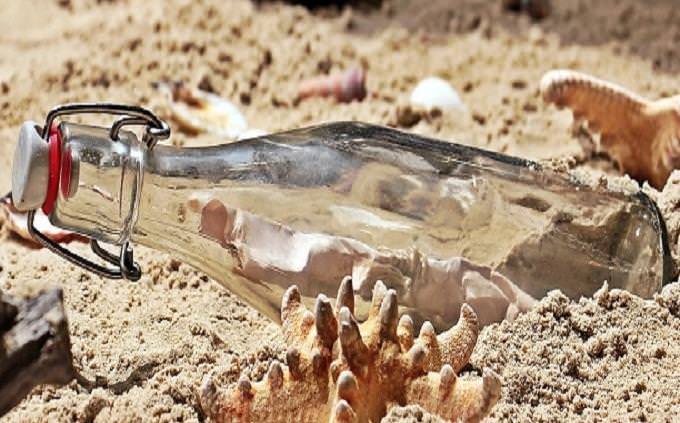 A glass bottle on a beach