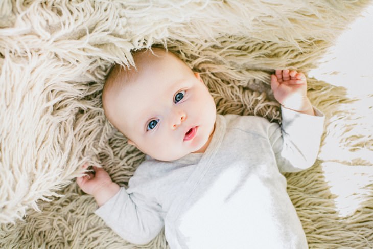 cute baby on a shaggy carpet