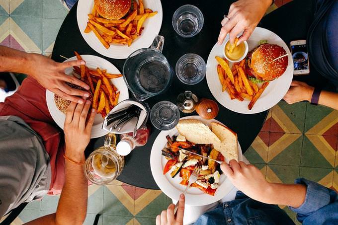 People sitting around the table in a restaurant