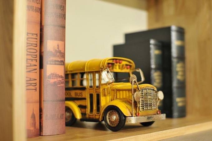 Yellow school bus on a shelf