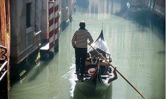 Gondolier sailing his boat