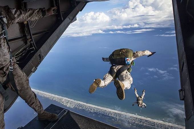 A soldier jumping out of an airplane