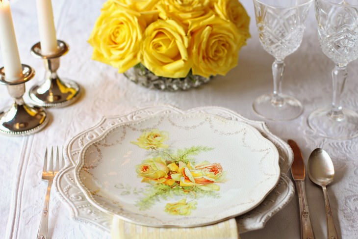 short senior jokes - fancy table arrangement plate, candles and yellow flowers