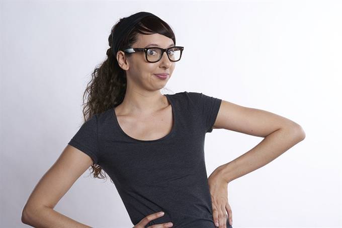 A woman standing with her hands on her hips