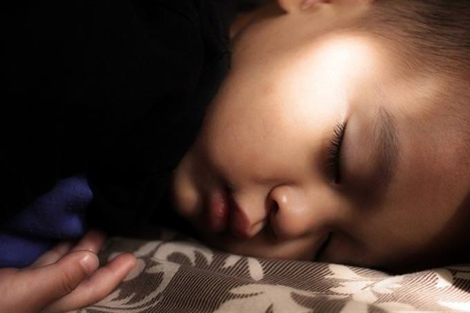A child sleeping in his bed
