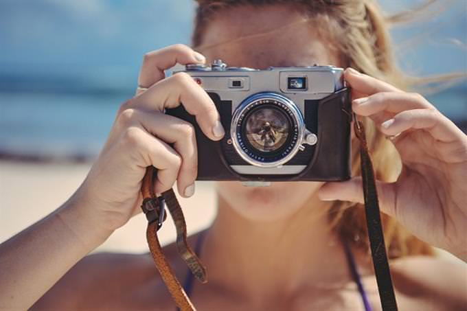 A woman holding a camera