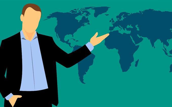 An illustration of a person pointing to a world map