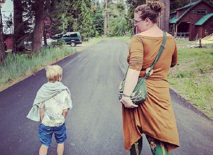 mom walking with her son on a road