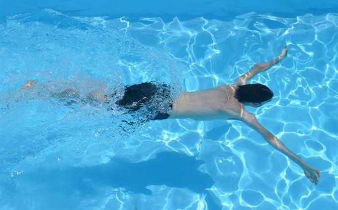 A man swimming in a pool