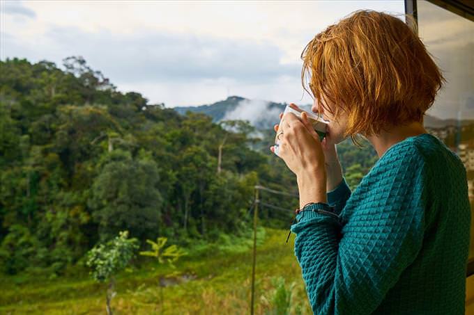 woman drinking tea outdoors