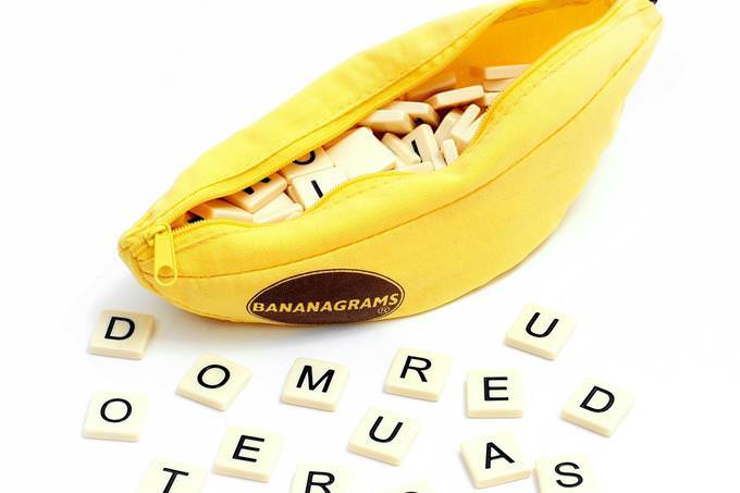 A banana-shaped pencil case with letters next to it