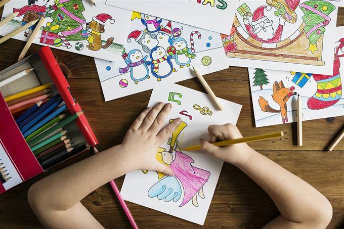 A child's hands painting