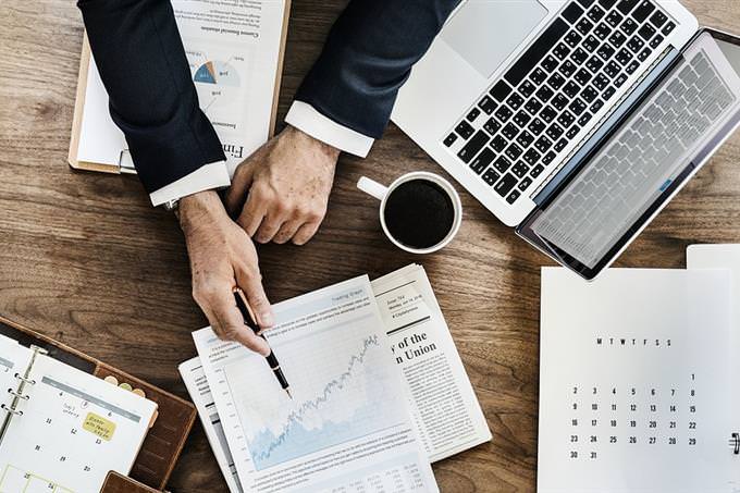 A desk with lots of documents