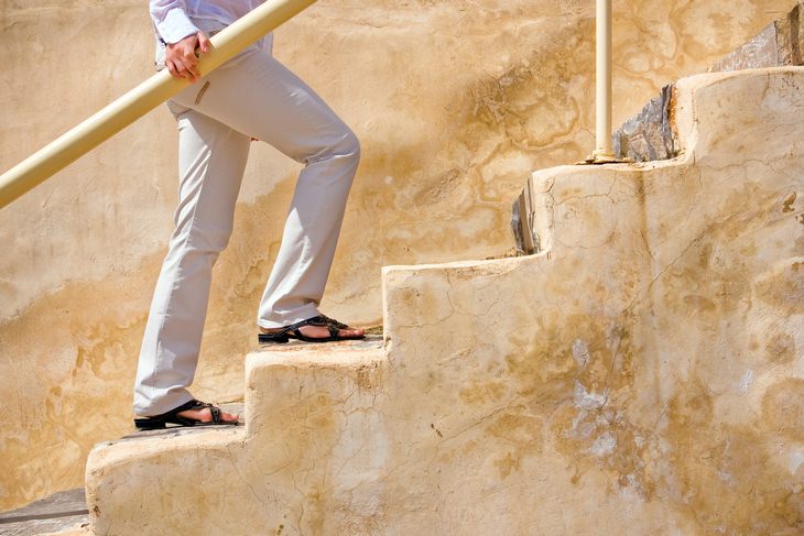 a woman walking up the stairs